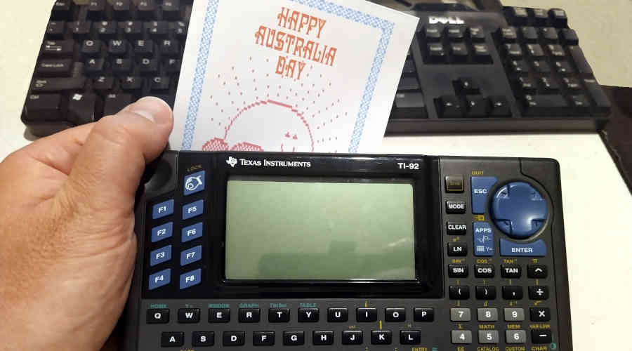 Holding happy Australia Day card and TI-92 computer
