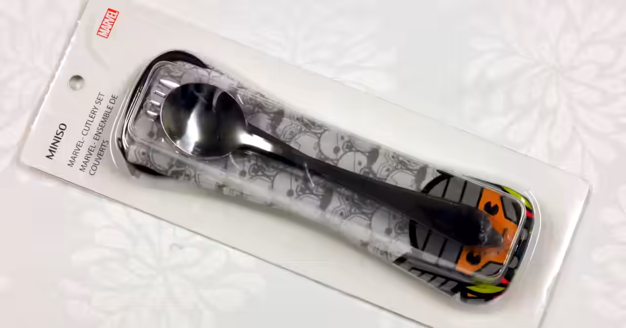 Miniso Marvel Thor cutlery set in retail packaging, showing stainless steel spoon, fork and knife with a rolled Thor-themed cloth carry bag